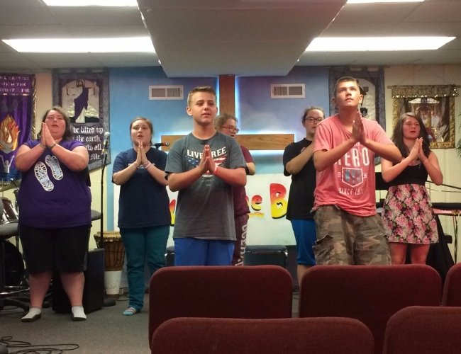 people praying in church
