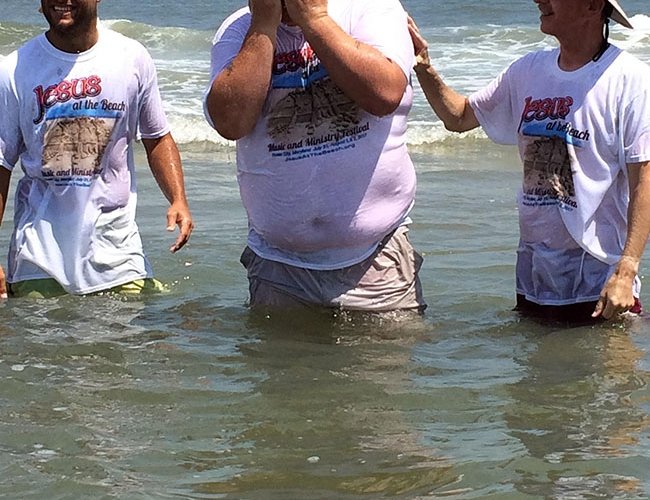 people being baptized in the ocean in ocean city md