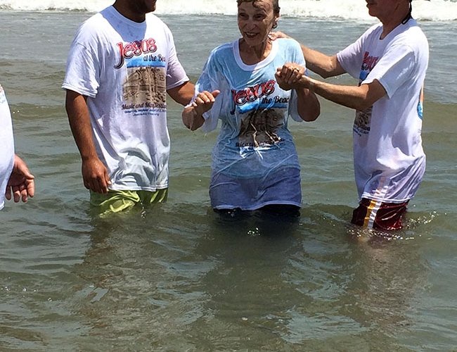 people being baptized in the ocean in ocean city md